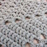 light grey star shaped crochet doily rug