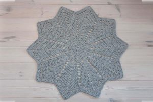 light grey star shaped crochet doily rug