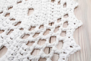 white crochet lace rug