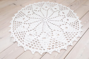 white crochet lace rug