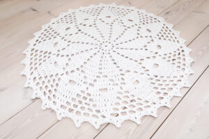 white crochet lace rug