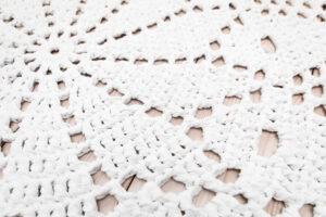 white crochet lace rug