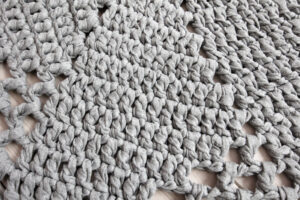 Light grey crochet doily rug