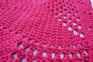 dark pink crochet doily rug for girl's room